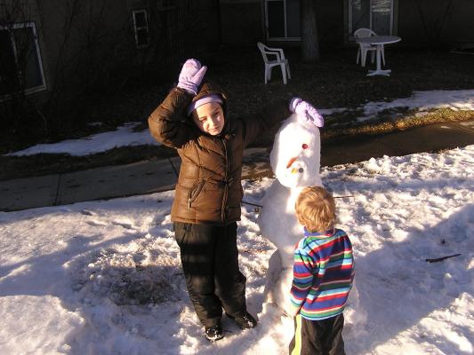 Malia with her snow person.