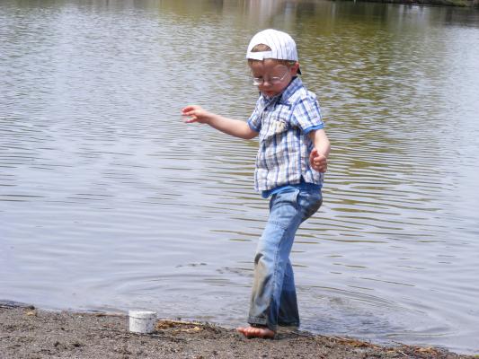 Noah plays at Bozeman Pond.