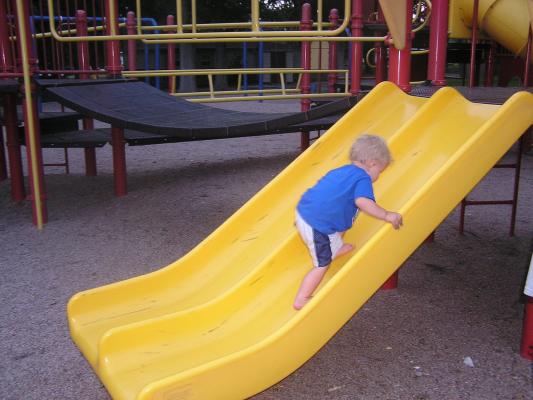 Noah goes back up the slide.
