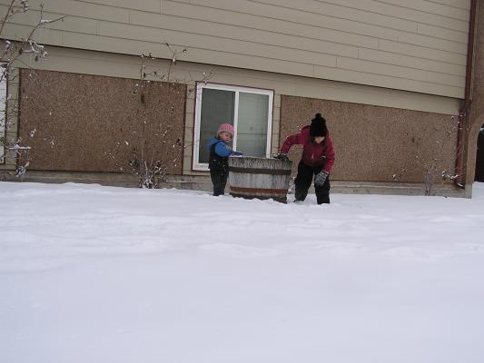 Noah and Andrea play in the snow.
