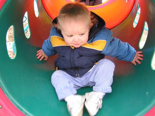 Noah plays at the play ground in Belgrade.