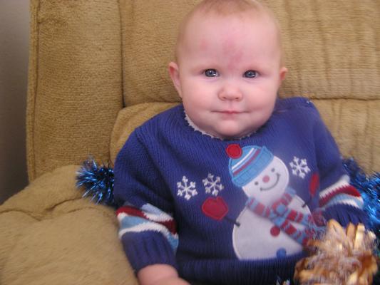Trying to get a good Christmas photo of Sarah.
She has a new blue sweater.