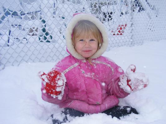 Sarah tastes some fresh snow.