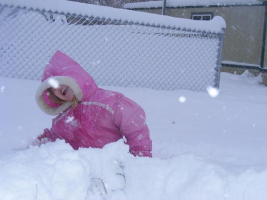 Sarah plays in the snow.