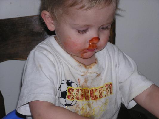 Noah got some ketchup on his nose.