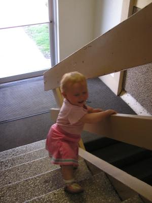 Sarah walks up the stairs.