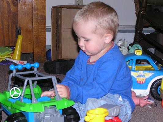 Noah playing cars.