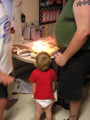 Noah watches as the cake is lit