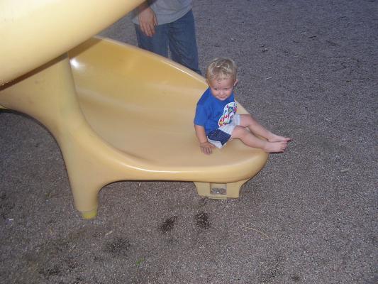 Noah at the bottom of the curly slide.