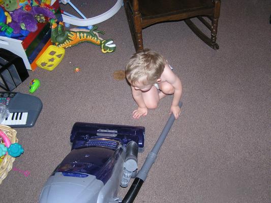 Noah likes to help vacuum up stuff.