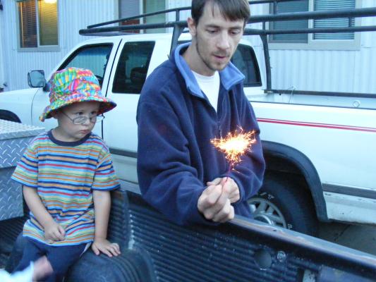 Noah wates David play with fireworks.