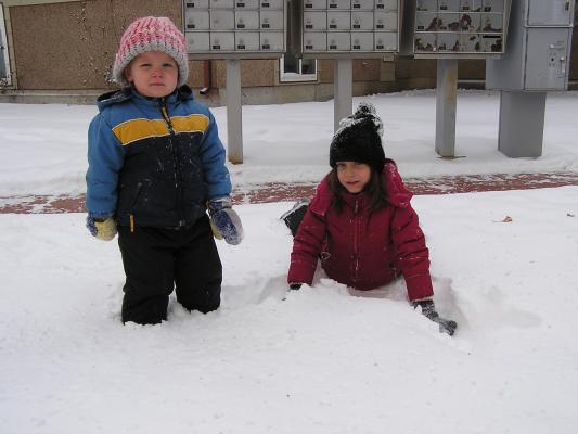Noah and Andrea play in the snow.