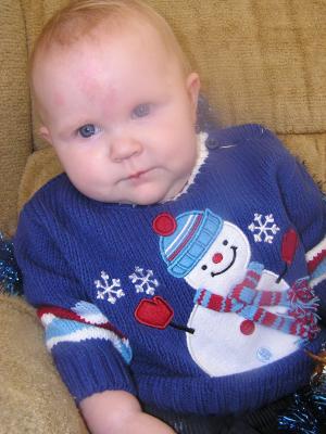 Trying to get a good Christmas photo of Sarah.
She has a new blue sweater.