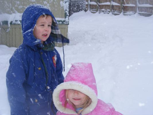 Noah and Sarah play in snow.