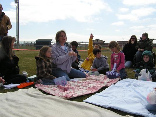 Deb tells the story of Easter to the kids using Resurrection Eggs.