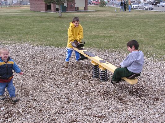 Kids playing at the park before the Easter egg hunt.