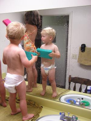 Andrea and Noah wash the mirror.
