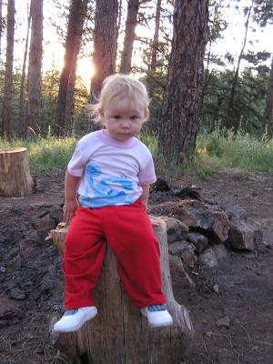 Sarah in a stump while camping
