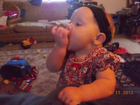 Hannah eating cheerios.