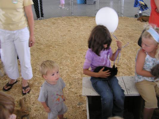 Andrea holds a bunny at the fair.