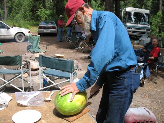 Robert cuts the watermelon.