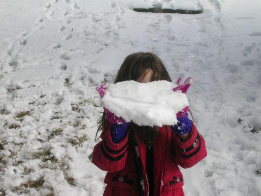 Andrea shows off a big snow ball.