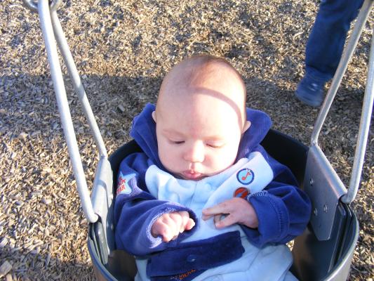 Joshua's first time in a park swing.