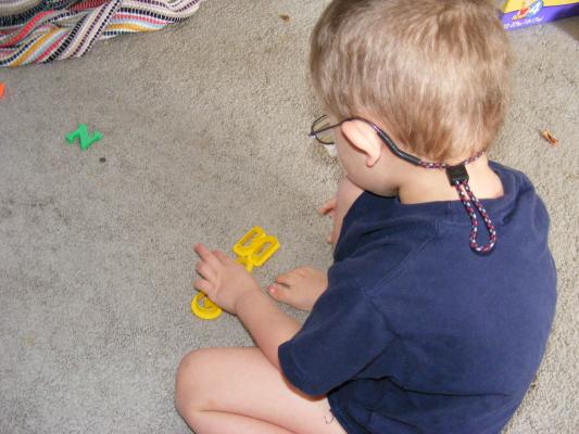 Noah plays with letters