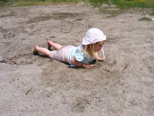 Sarah plays in the sand at Bozeman Pond.