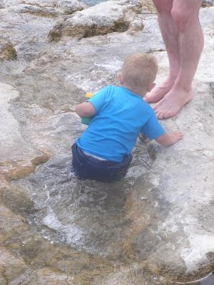 Noah plays in the pools at the top of the waterfalls.
