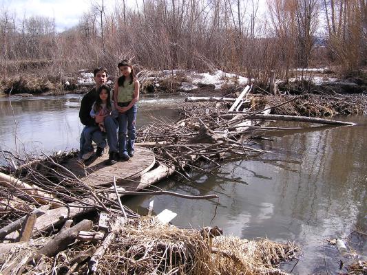 Andrea, Mike and Malia on the beaver dam.