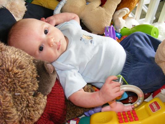 Noah got all the baby toys for Joshua to play with.