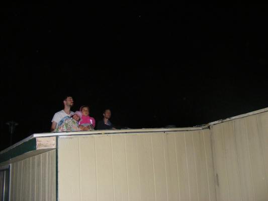 Andrea, Mike, Malia and David watch fireworks on the roof.
