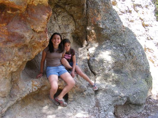 Malia and Andrea in rock crevice.