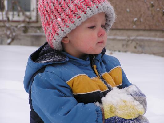 Noah plays in the snow.