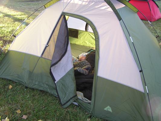 Noah sleeping in the green tent.