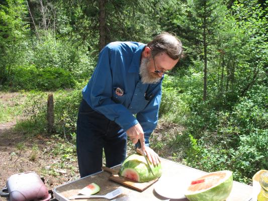 Robert cuts the watermelon.