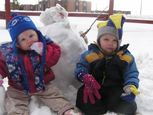 Sarah andf Noah like to play in the snow.