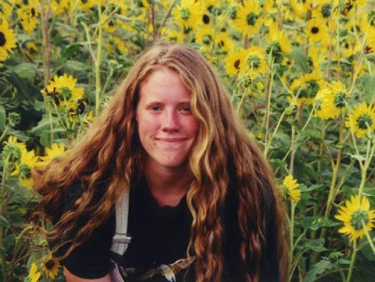 Katie in a field of sunflowers