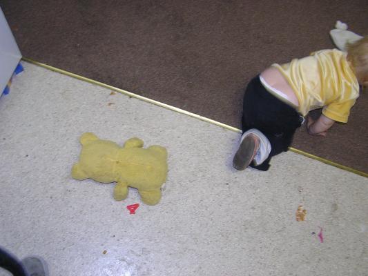 Sarah leaves a Pooh bear on the floor.