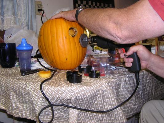Walt carves a pumpkin with nothing but a drill.