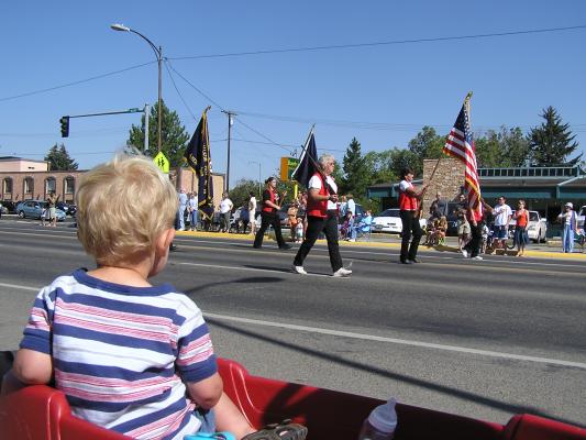 Noah watches the flag go by in the Sweet Pea Festival parade.