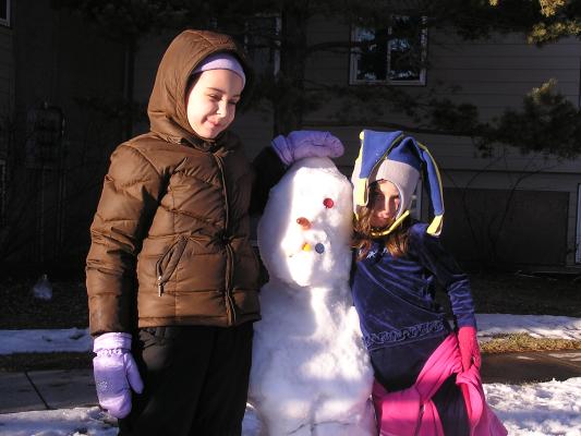Malia, Andrea and the snow person.