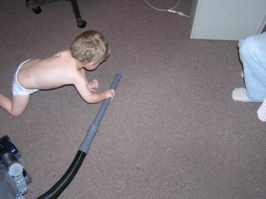 Noah likes to help vacuum up stuff.