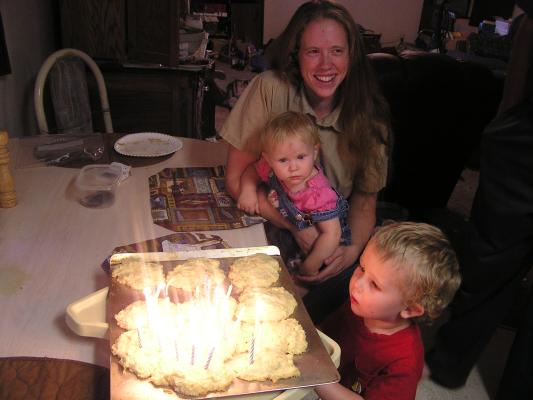 Katie, Sarah and Noah are ready to blow out the candles