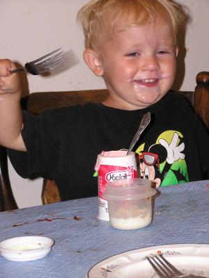 Noah eats some Yoplait Yogurt.