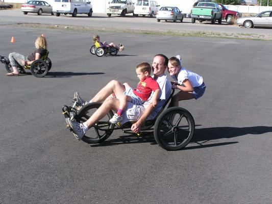 The Beers family share a ride on the trike.