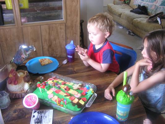 We made a candyland cake for Noah's third birthday. Here is the birthday boy with Andrea