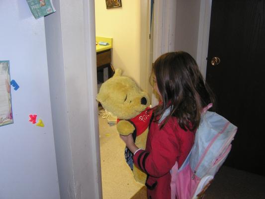 Andrea gets Pooh Bear ready for his first day of school.