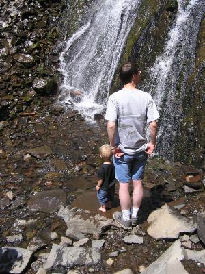Noah and David look at the waterfall.